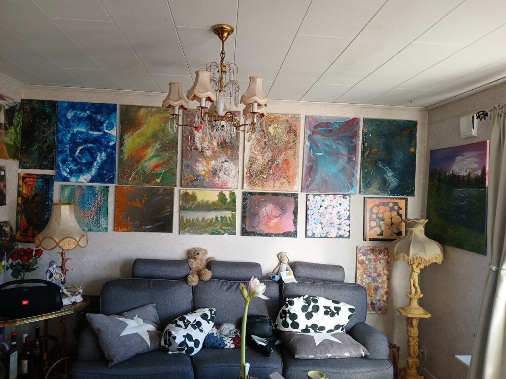 Before view for my friday reflection everyday conversations – a living room filled with paintings, memories and my grandmother’s lamp, full of color and history.