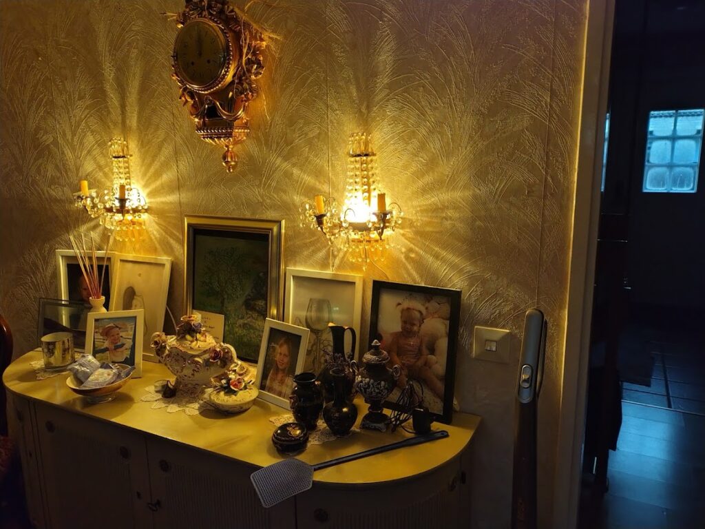 Autumn day of stillness – rain and love. Grandmother’s and great-grandmother’s sideboard glowing with candlelight and family photos.