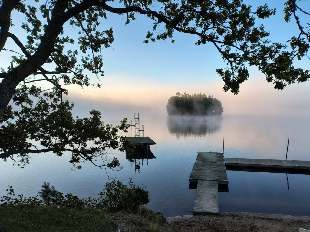 Misty lake and jetty, morning swim and a sense of belonging in nature.