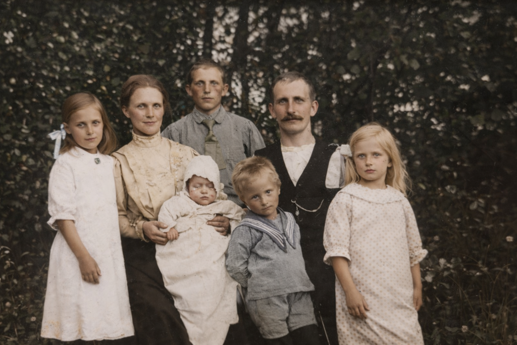 Colorized historical family photograph showing a grandmother and welfare state era family in a garden. A young girl stands close to her father. She is Carina Ikonen Nilsson’s grandmother, born in 1912.