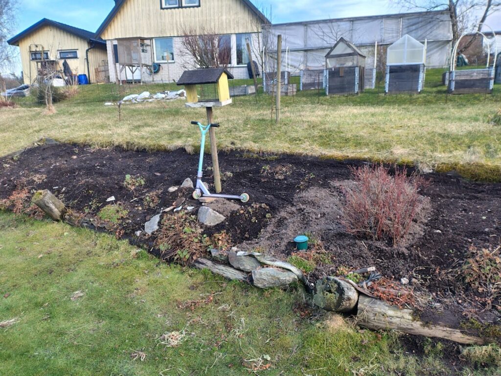 Garden slope with fresh soil in garden life in April