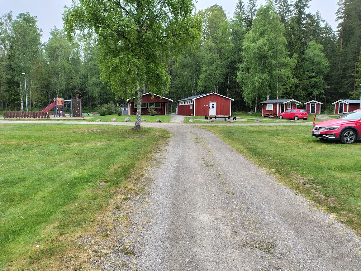 Motorhome at Lunnedet Camping Karlskoga surrounded by forest